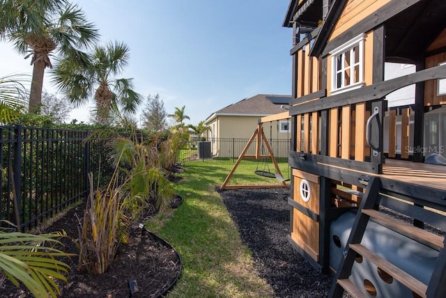 view of yard with cooling unit and a playground