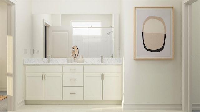 bathroom featuring an enclosed shower and vanity