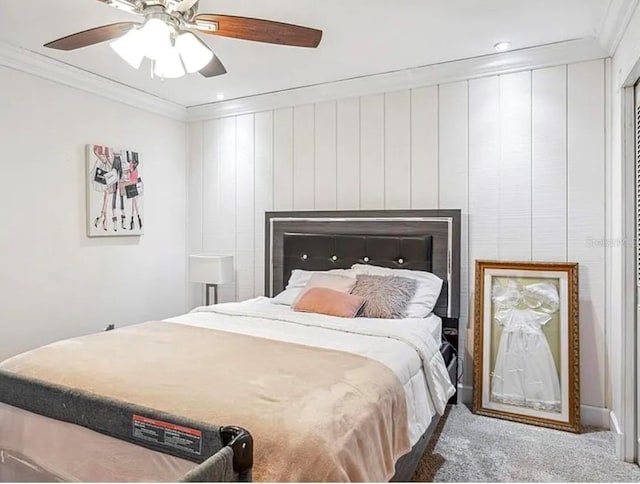 carpeted bedroom with crown molding and ceiling fan