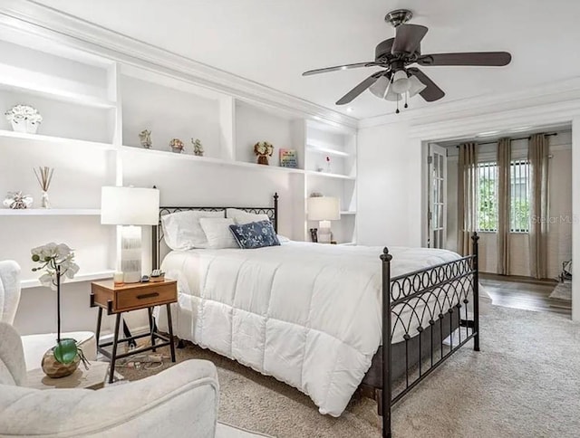 bedroom with crown molding, ceiling fan, and carpet flooring