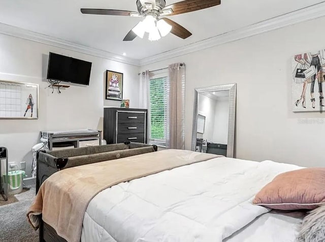 bedroom with ornamental molding, ceiling fan, and carpet