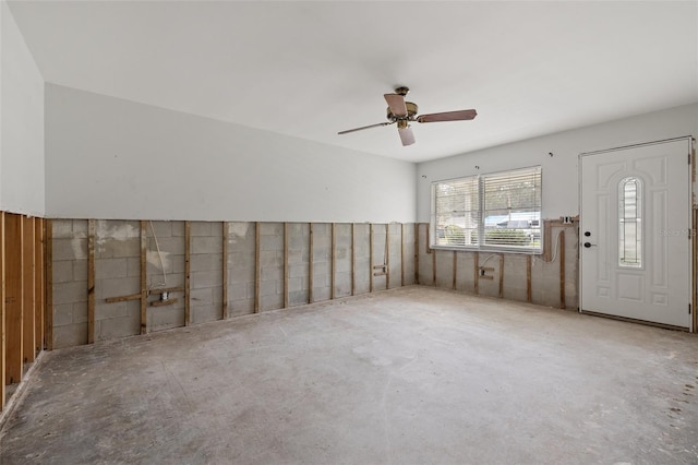 empty room with concrete flooring and ceiling fan