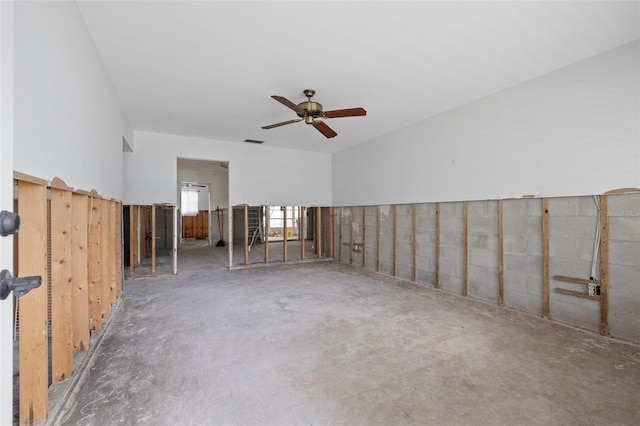 spare room featuring concrete flooring and ceiling fan