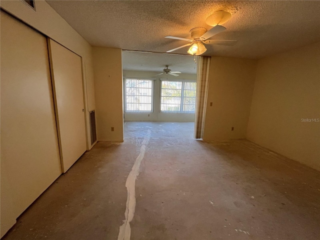 empty room featuring a textured ceiling