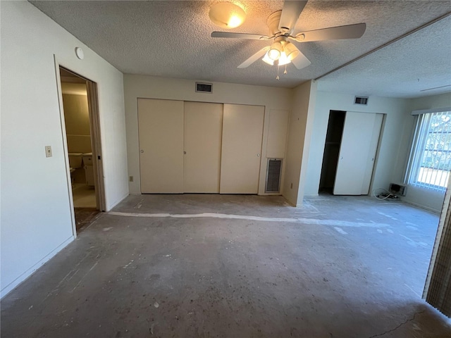 unfurnished bedroom featuring ceiling fan and a textured ceiling