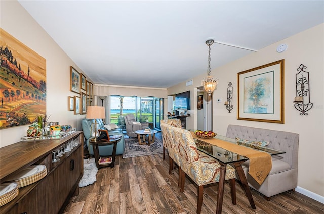 dining room with dark wood-type flooring