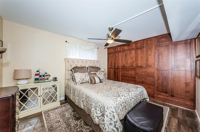 bedroom featuring dark wood-type flooring and ceiling fan