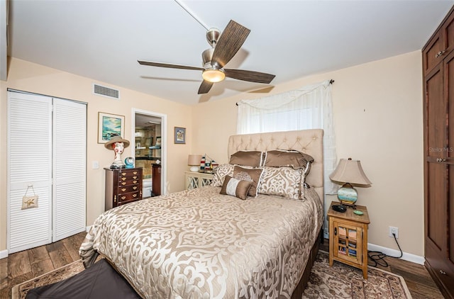 bedroom featuring a closet, dark hardwood / wood-style floors, and ceiling fan