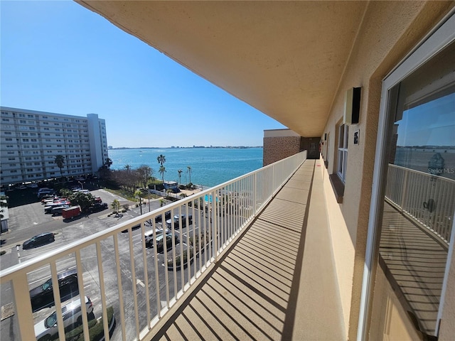 balcony featuring a water view