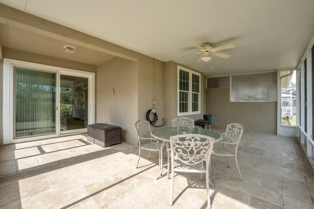 sunroom / solarium with ceiling fan