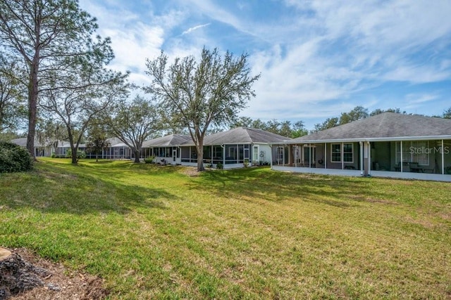 view of yard featuring a sunroom