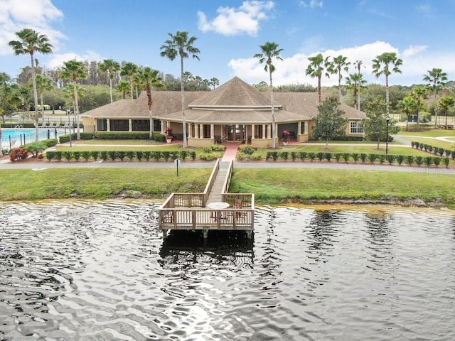 exterior space featuring a yard, a gazebo, and a water view