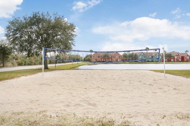 view of home's community featuring volleyball court