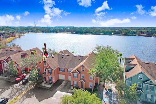 birds eye view of property featuring a water view