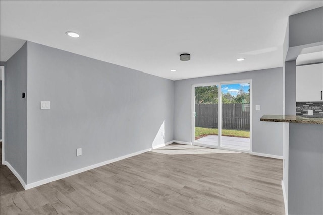 unfurnished living room with light wood-type flooring