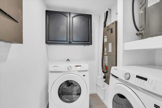 laundry room featuring cabinets and independent washer and dryer