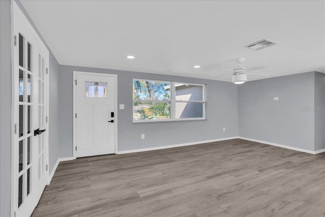 entryway with ceiling fan and light wood-type flooring