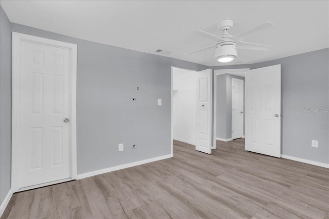 spare room featuring ceiling fan and light wood-type flooring