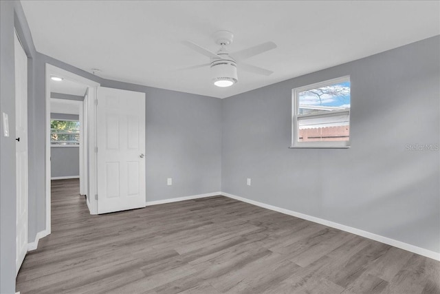 spare room featuring ceiling fan and light wood-type flooring