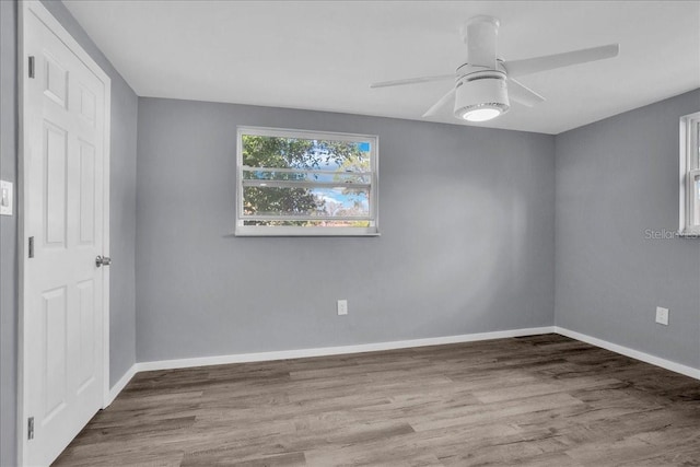 unfurnished room with ceiling fan and light wood-type flooring