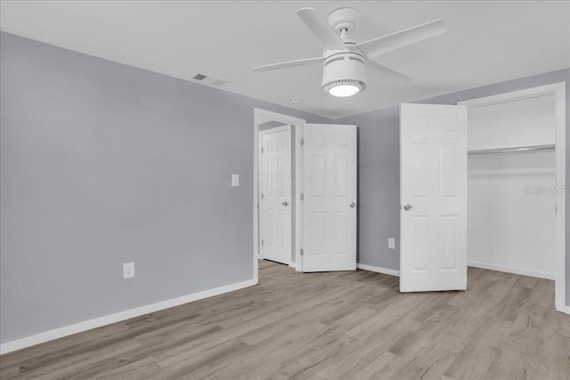 unfurnished bedroom with a closet, ceiling fan, and light wood-type flooring