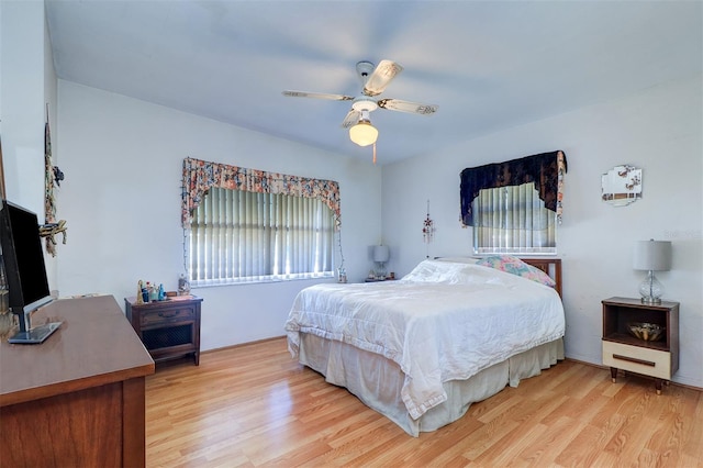 bedroom with ceiling fan and light hardwood / wood-style flooring