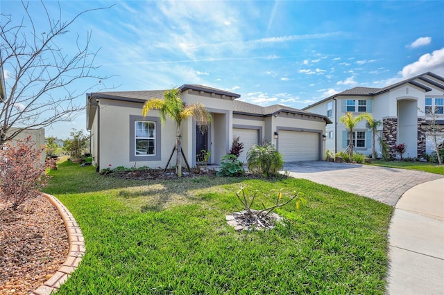 view of front of property featuring a garage and a front lawn