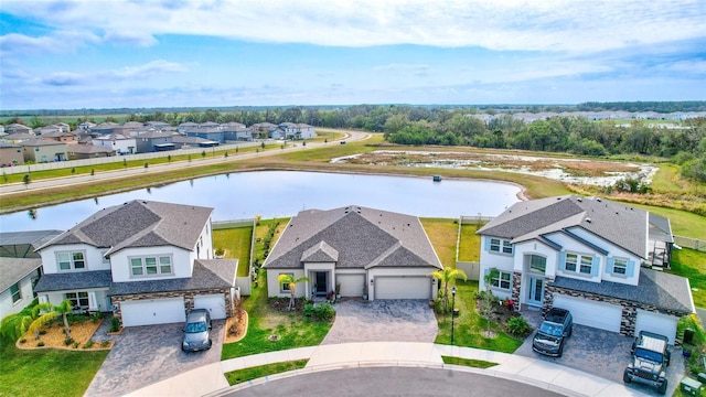 birds eye view of property with a water view