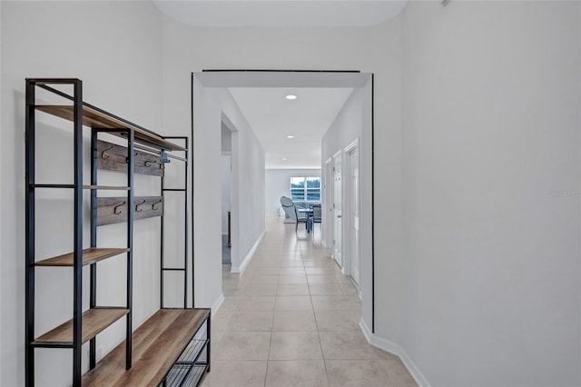 corridor with light tile patterned flooring