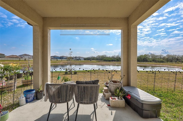 view of patio featuring a water view