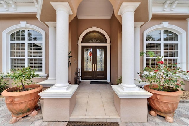 view of exterior entry featuring french doors