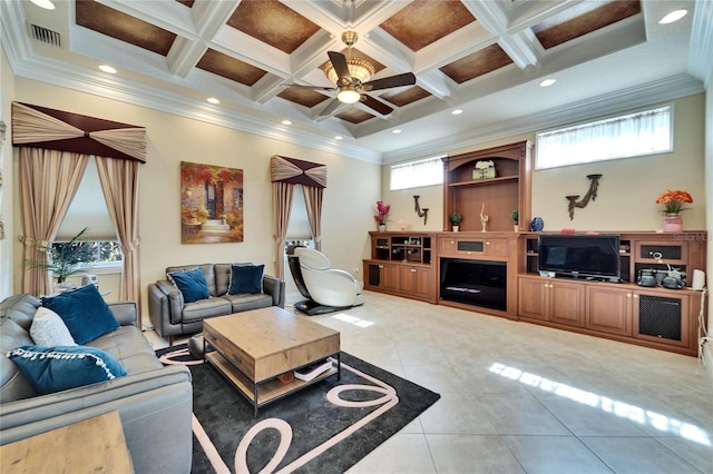 tiled living room with coffered ceiling, beam ceiling, ornamental molding, and ceiling fan