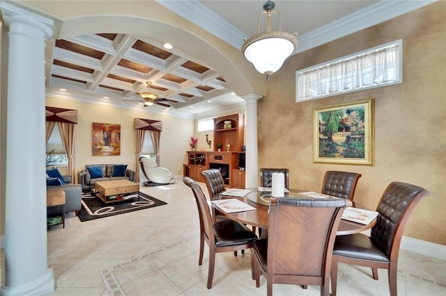 tiled dining area featuring ceiling fan, coffered ceiling, ornamental molding, beamed ceiling, and ornate columns