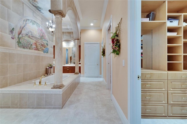 bathroom with tile patterned flooring, vanity, ornamental molding, and decorative columns