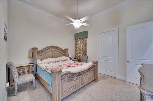 carpeted bedroom featuring crown molding and ceiling fan