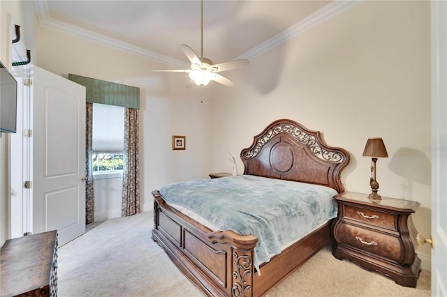 carpeted bedroom featuring ceiling fan and ornamental molding