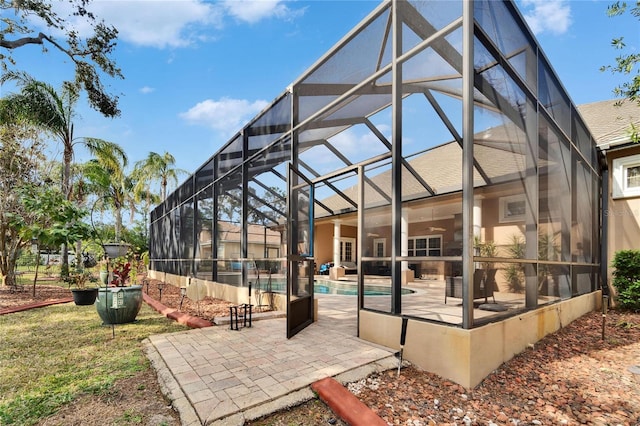 view of patio / terrace featuring a lanai