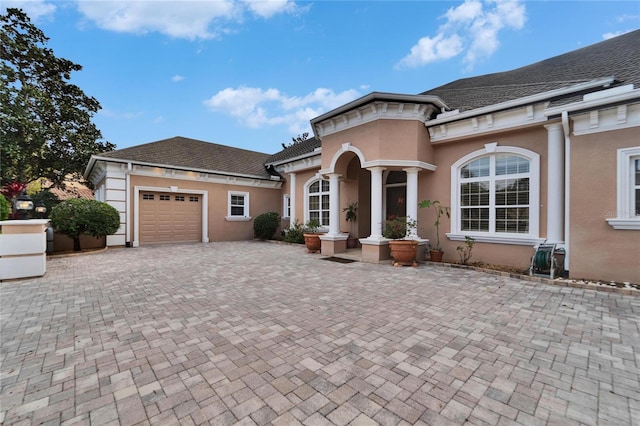 view of front of property featuring a garage