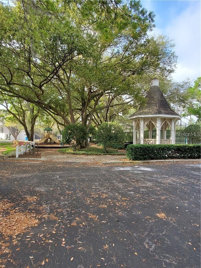 view of home's community featuring a playground and a gazebo