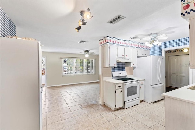 kitchen featuring white cabinetry, white appliances, ceiling fan, and light tile patterned floors