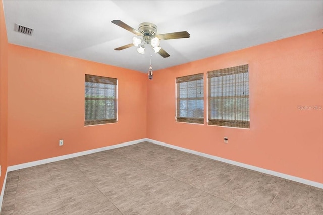 unfurnished room with ceiling fan