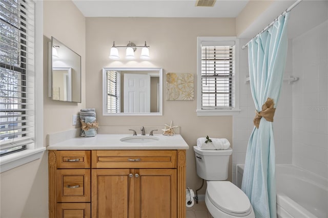 full bathroom featuring vanity, shower / bath combination with curtain, and toilet