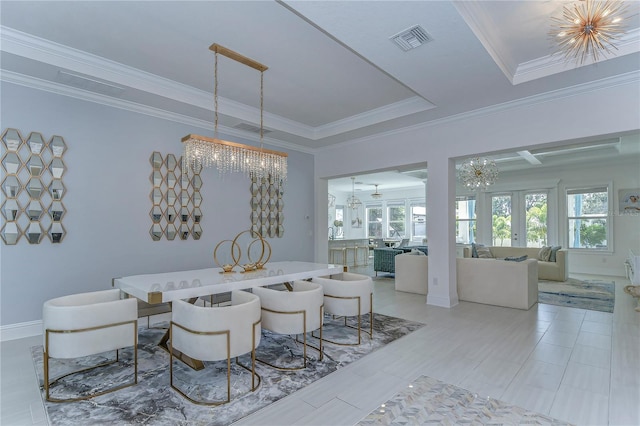 dining room featuring a chandelier, visible vents, french doors, a raised ceiling, and crown molding