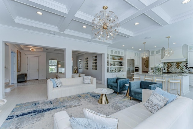 living area featuring a chandelier, ornamental molding, beamed ceiling, and coffered ceiling