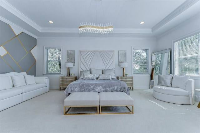 carpeted bedroom with ornamental molding, multiple windows, and baseboards