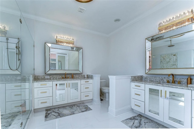 bathroom with toilet, ornamental molding, and a sink