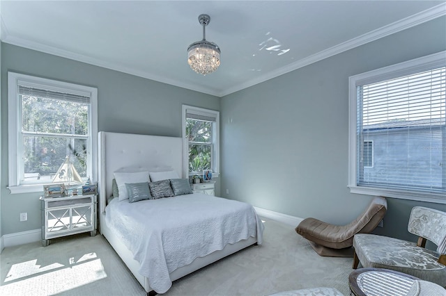 bedroom with an inviting chandelier, baseboards, ornamental molding, and carpet flooring