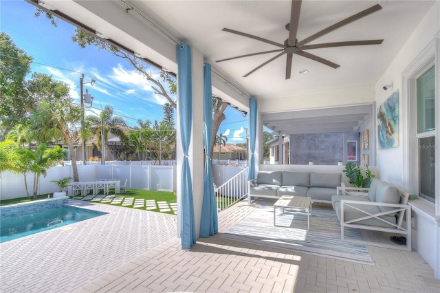 sunroom featuring a ceiling fan