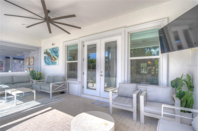 view of patio featuring an outdoor living space, a ceiling fan, and french doors