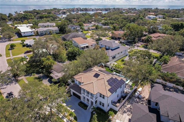 bird's eye view with a residential view and a water view